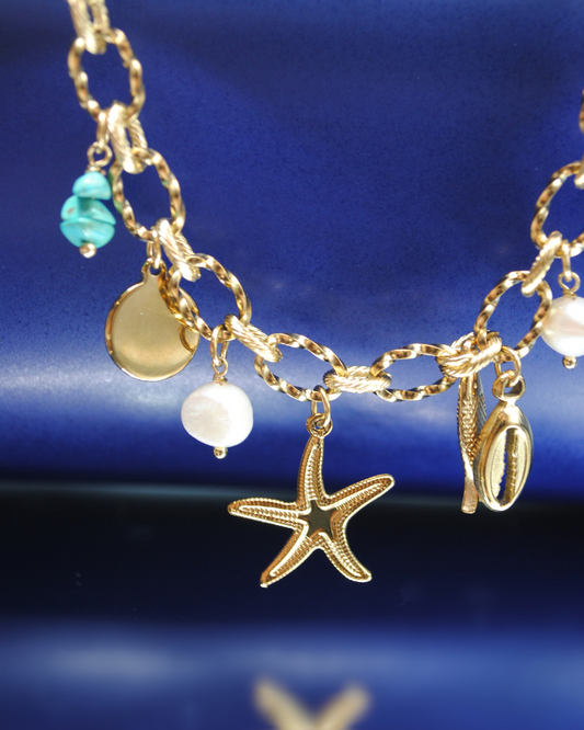 Bracciale Tahiti in acciaio dorato con charms